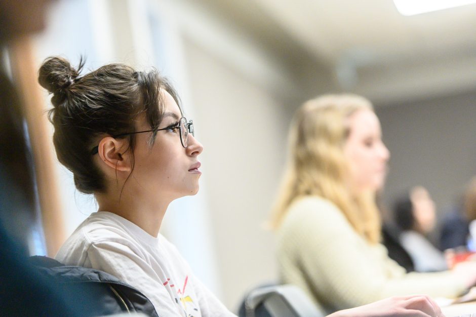 A student watching a presentation with absolute focus.
