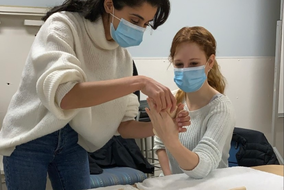 Students in a clinical setting.