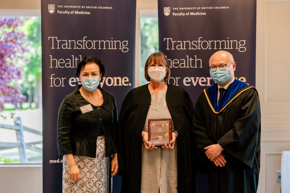 Liisa Holsti receives her promotion to Professor from Department Head Sue Forwell and Acting Dean of the Faculty of Medicine, Roger Wong