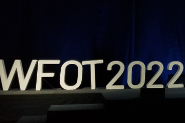 3D sign on stage reading WFOT 2022