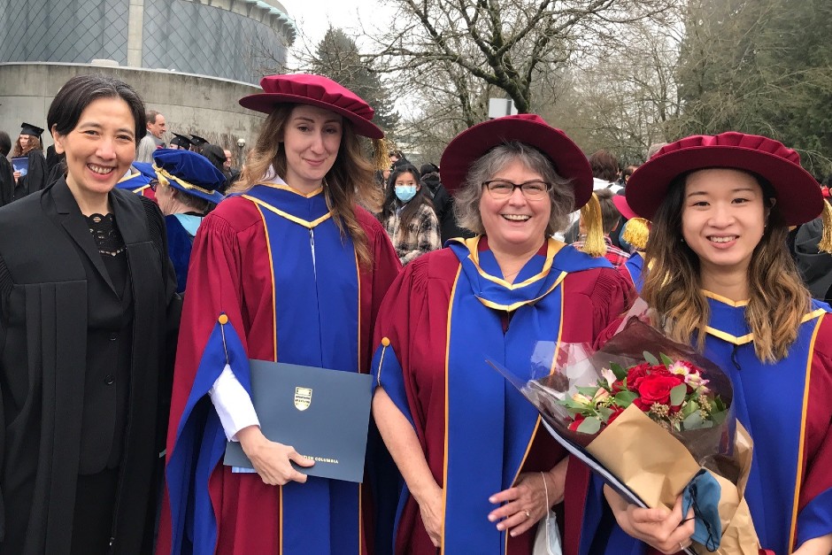 Catherine Backman with PhD students at the 2021 convocation